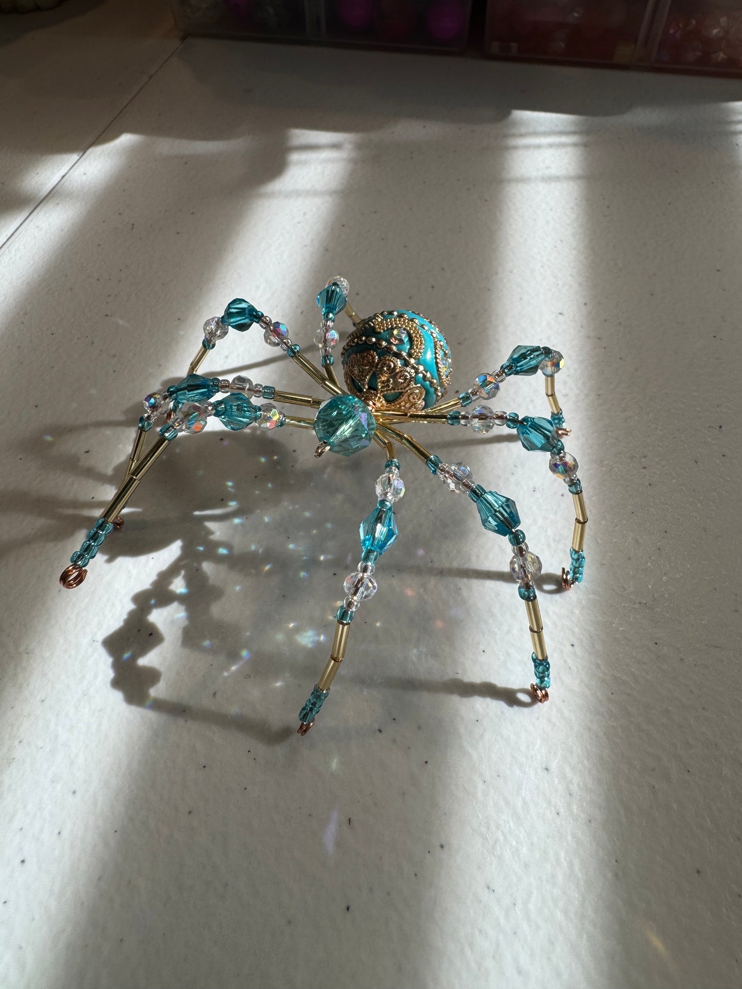 53. Teal/Gold Spider Suncatcher